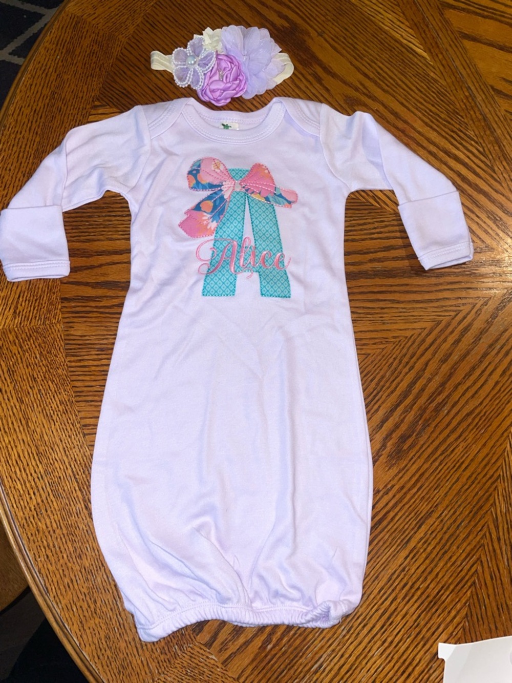 Newborn laughing giraffe monogram “Alice” gown(0-3) with hair accessory